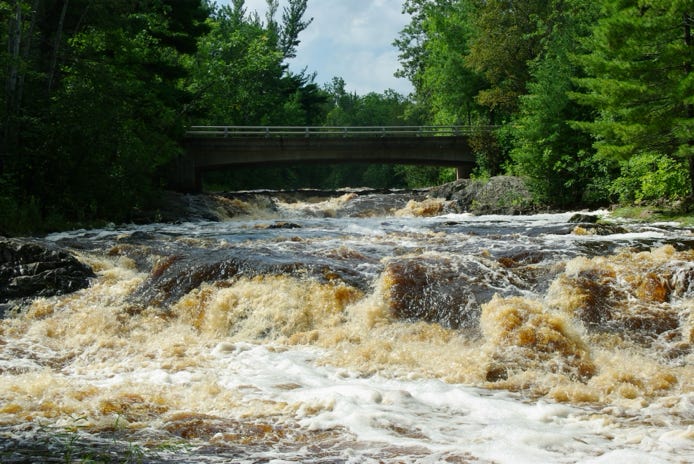 Amnicom Falls State Park is a great spot to visit. There are a series of waterfalls and rapids there, along with a covered bridge and several fun trails, places to picnic and camp. 